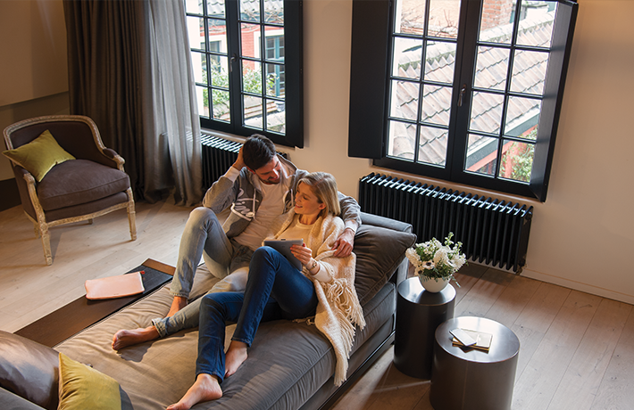 Couple talking on couch